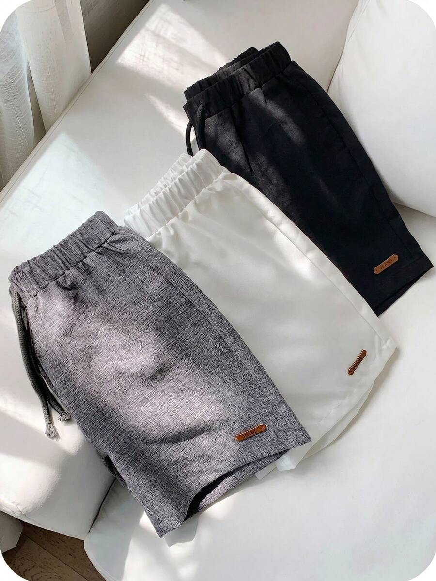 SHEIN 3件組青少年男款休閒學院風素色短褲,彈性腰帶與裝飾繩設計,適合春夏季日常穿著、運動、出遊、上學、派對、節慶、拍照 - 黑色 - View 1