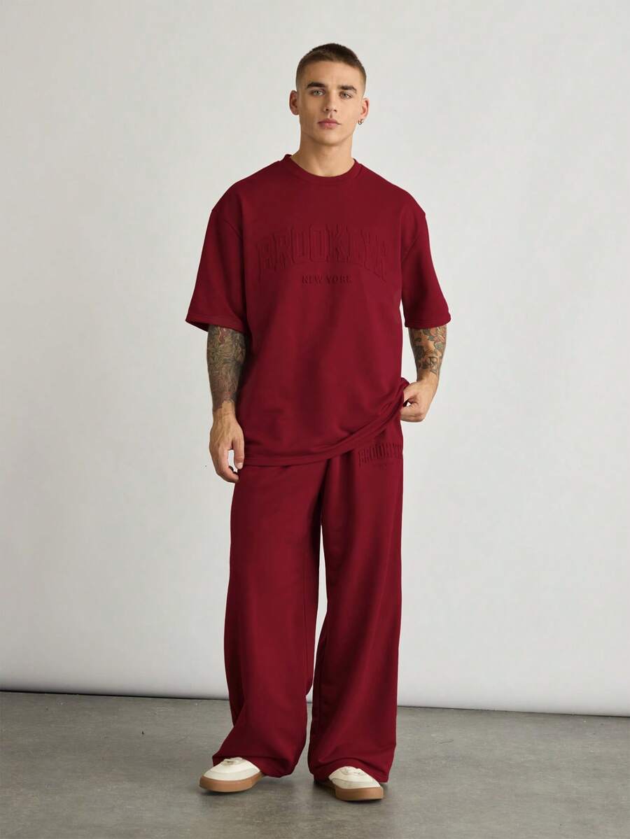 NORVETH 2pcs/Set Men's Loose Dropped Shoulder Round Neck Short Sleeve T-Shirt And Drawstring Waist Straight Leg Pants Set - Burgundy - View 1