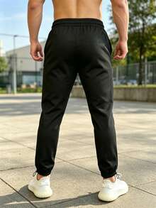 Coreblaze Men's Casual Daily Letter Pattern Drawstring Waist Sports Long Pants, Gym - Black - View 2