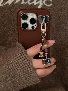 Zazumi 1個可愛熊相機肩帶手鍊荔枝紋皮革手機殼，適用於 iPhone 17 Pro Max 17 Pro 17 16 Pro Max 16 Pro 16 15 Pro Max 15 Pro 15 14 Pro Max 14 Pro 14 13 Pro Max 13 Pro 13 背蓋保護殼 - 棕色 - 查看 2