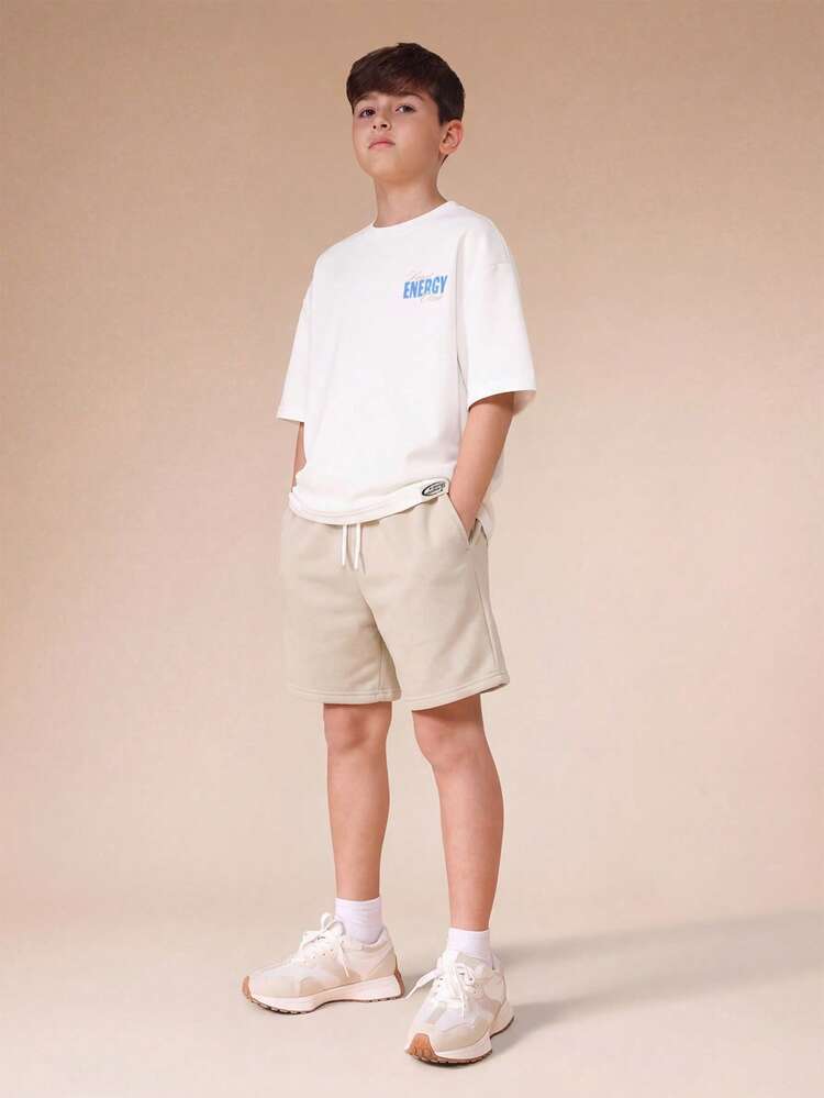 Set coordinato casual da strada, composto da maglietta oversize a maniche corte con grafica e slogan e pantaloncini, per ragazzi