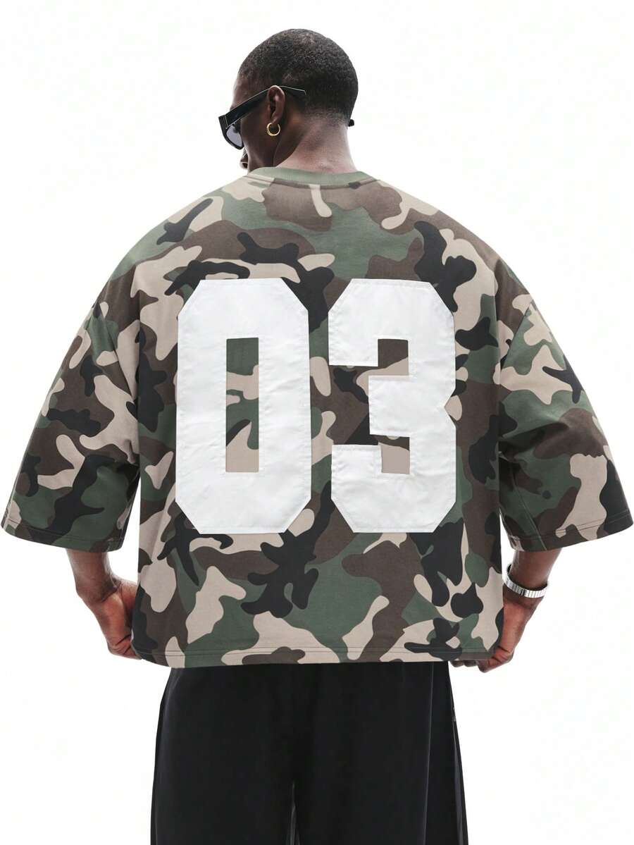 STYNVO Kaos Pria Kasual Musim Panas Motif Kamuflase Digital Patchwork dengan Bahu Jatuh dan Potongan Longgar - Hijau Tentara - View 1