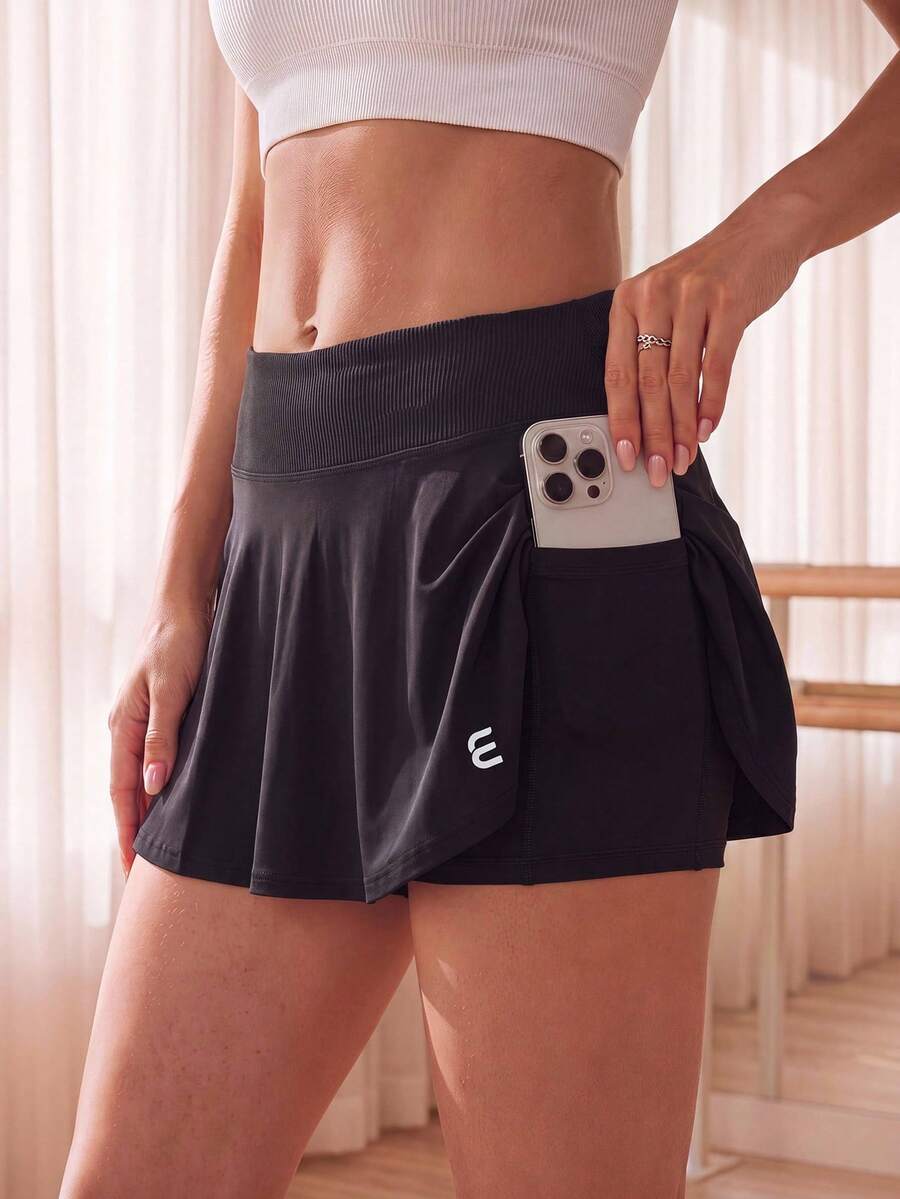 Rok celana pendek wanita Eassivo warna polos, bertekstur rib, berpotongan lebar, pinggang lebar, serbaguna untuk aktivitas sehari-hari dan luar ruangan, model 2 in 1 dengan saku. - Hitam - View 1