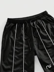 ROMWE MEN Street Life Conjunto de camiseta sin mangas de cuello redondo y pantalones cortos con bolsillo y lazo en la cintura para hombre - Blanco y Negro - Ver 5