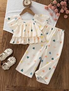 SHEIN Genkimix Kids 春夏女童/青少年2件套套裝，彩色愛心印花方領短袖上衣 + 寬腿長褲，方領短袖設計適合夏季，雙層荷葉邊下擺剪裁增加層次感，鮮豔彩色愛心印花俏皮吸睛；配色寬腿長褲俐落優雅，整體風格清新活潑，適合日常出遊、遊樂園、聚會、親子活動等 - 彩色 - 查看 7