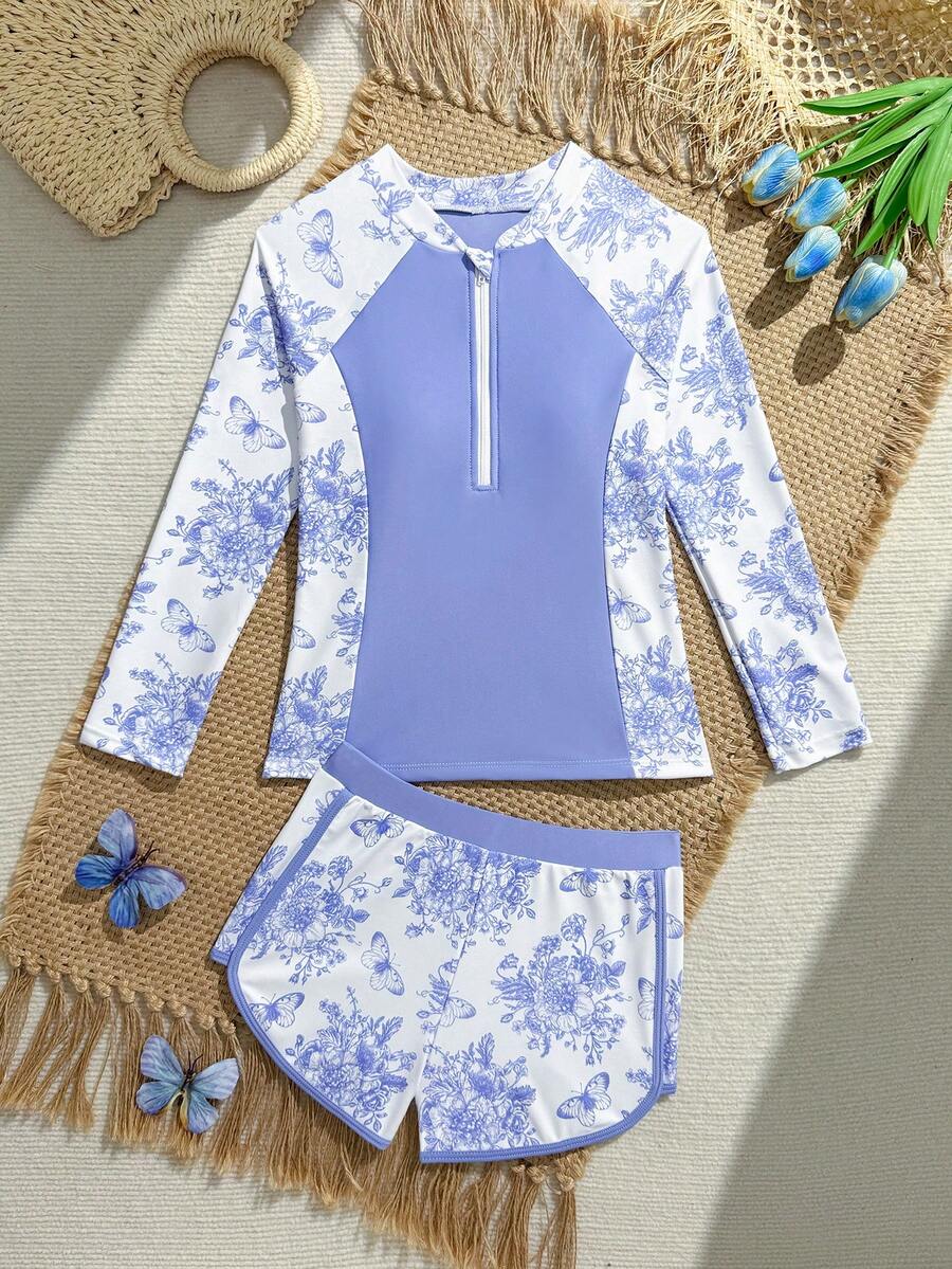 SHEIN 青少年女孩坦基尼比基尼泳裝套裝,2件分開式,可愛藍紫色蝴蝶花卉植物與動物印花,針織面料,領口與袖口細節,側面花卉蝴蝶動物印花,前拉鍊,純色腰帶,蝴蝶花卉植物與動物印花身軀,純色腿口飾邊,時尚休閒優雅成熟淑女風,適合游泳、夏季度假、海灘、海濱、泳池、夏季假期派對、休閒出遊 - 藍色 - 查看 1