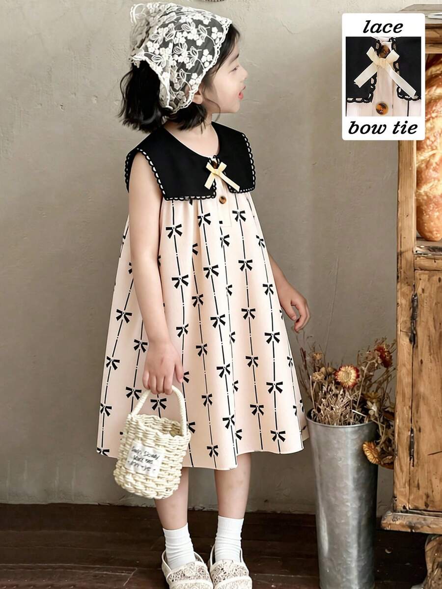 SHEIN Elladie kids 女童春夏简约时尚新款连衣裙,杏色丝带3D蝴蝶结装饰,杏色底黑色蝴蝶印花提花面料,黑色简约花领,咖啡琥珀色纽扣半开襟无袖连衣裙,适合年轻女孩,韩式简约优雅风格,休闲时尚,适合上学、外出、度假、春夏穿着。夏季服装。柔软舒适。 - 杏色 - 查看 1
