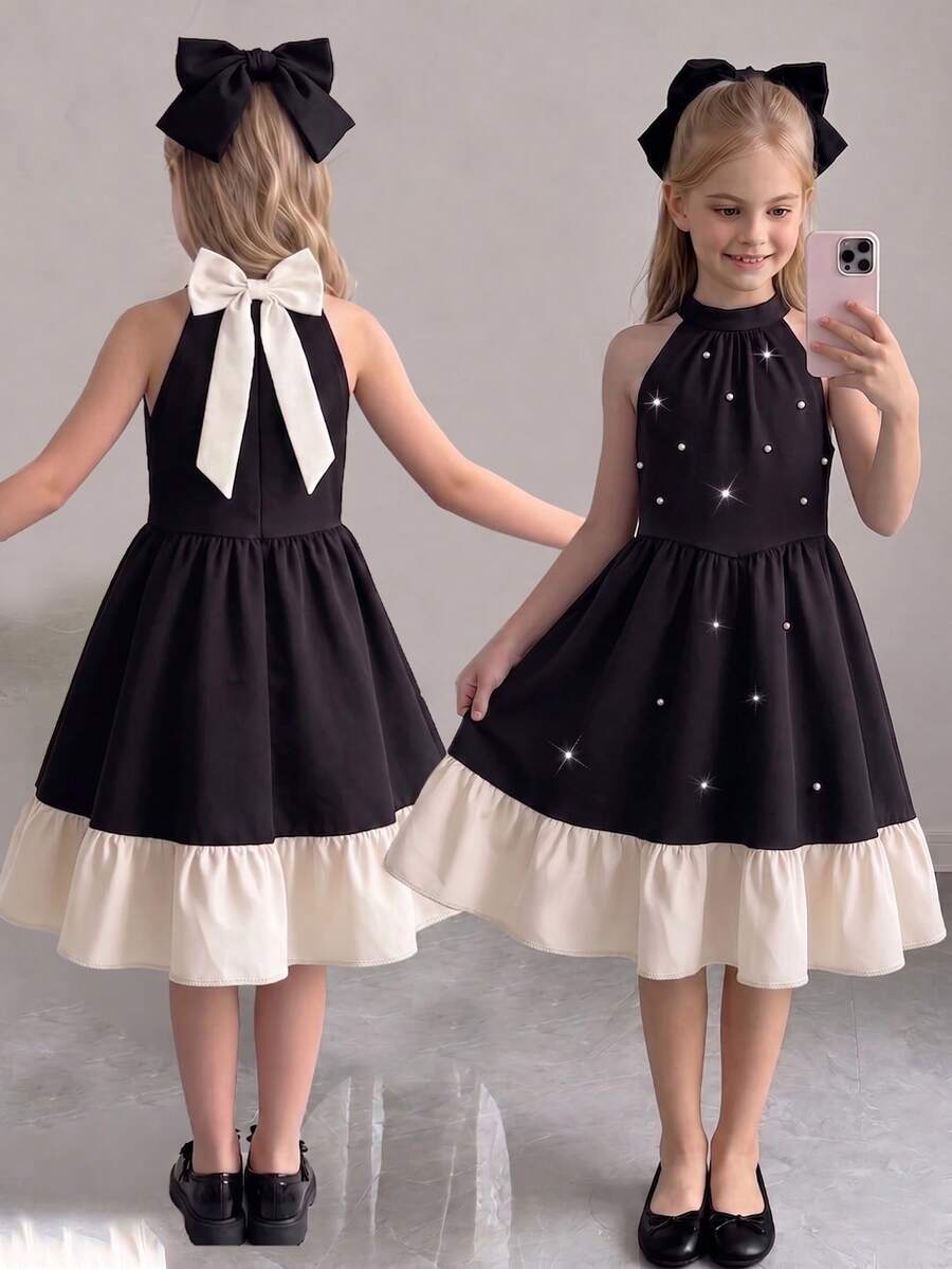 Elladie kids 一件优雅的少女黑色吊带连衣裙，白色荷叶边下摆，点缀珍珠，轻盈的雪纺A字廓形，腰部柔软的褶裥设计，适合生日派对、婚礼、学校活动、家庭聚会、早午餐约会、城市庆典和派对等场合。