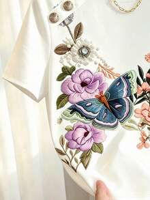 SHEIN Franclia White Short Sleeve T-Shirt, Featuring Heavy Embroidery Of Flowers And Birds As The Core Highlight, Vivid Blue Butterfly And Pink-Purple Floral Patterns With Rich Layers And Exquisite Detail. Metal Buckle Design On Shoulder Line Adds A Crisp Texture, Slim Fit Paired With Curved Hem, Simple Yet Elegant, Easily Enhancing The Sophistication Of Daily Outfits. - Multicolor - View 4
