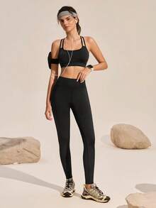 Exploreva Damen Sport-Set mit gekreuzten Trägern, ärmellos, einfarbig, geeignet für Yoga und Outdoor-Sport - Schwarz - Übersicht 4