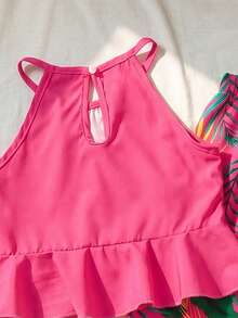 SHEIN Vintaside Kids 少女露背領口套裝，亮麗桃紅色與熱帶花卉印花，充滿活力且吸睛。露背設計清新舒適，荷葉邊下襬增添甜美層次感，寬腿褲鬆適自在，方便活動。面料滑順，色彩鮮豔，適合度假與日常穿著，散發青春活力。 - 玫紅色 - 查看 6
