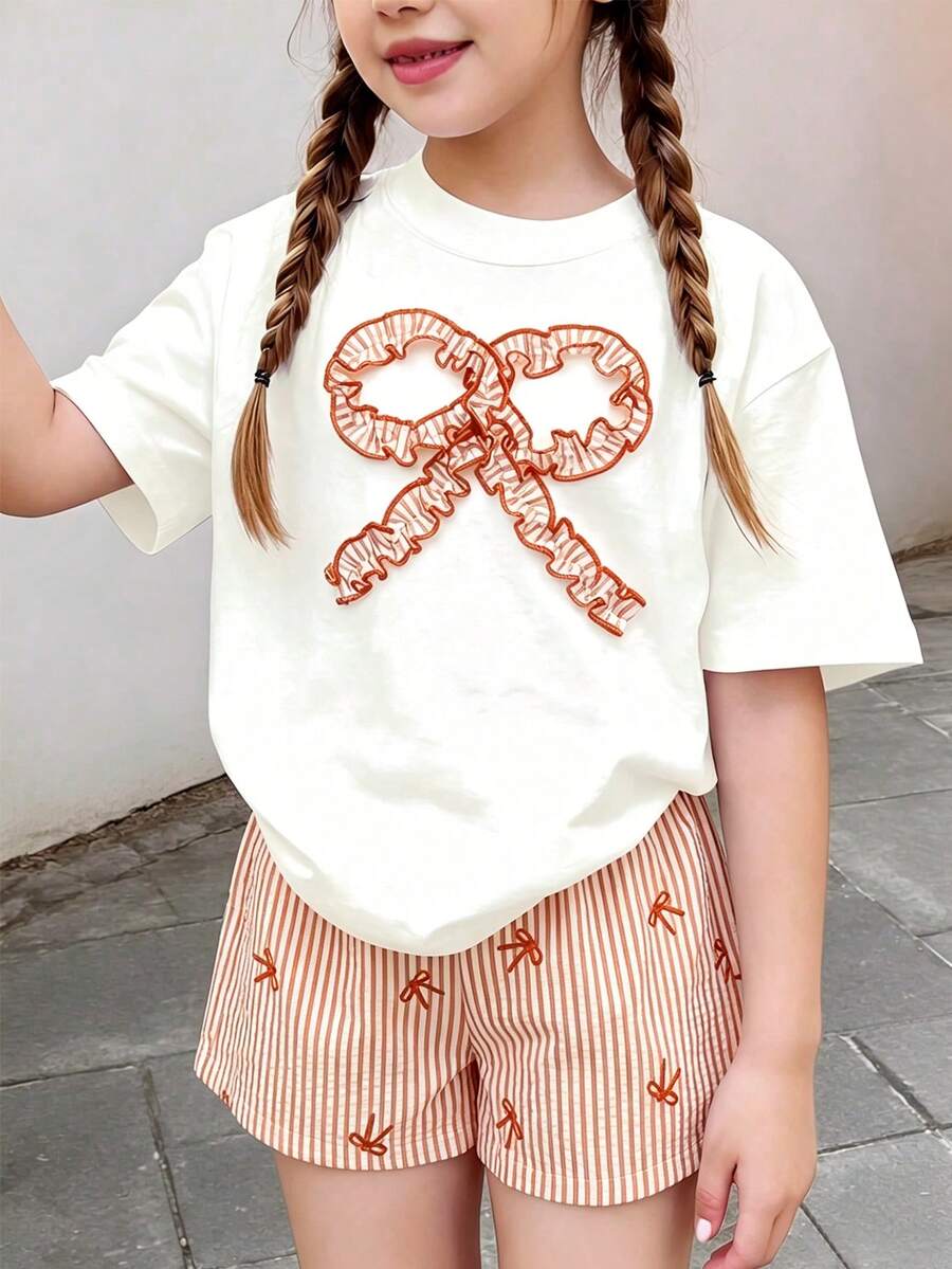 Sparklyn 2件組青少年女孩夏季套裝 - 白色寬鬆短袖圓領T恤配蝴蝶結裝飾 + 寬鬆條紋蝴蝶結短褲,可愛甜美花卉印花與蝴蝶結裝飾,適合日常穿著與戶外玩耍 - 橘色 - 查看 1