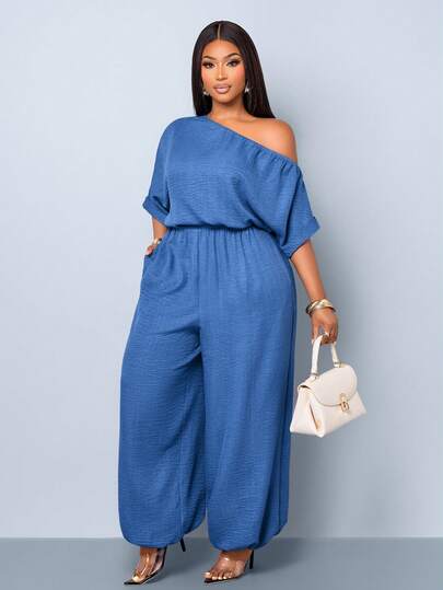 SOLERSUN Bộ jumpsuit nữ size lớn thiết kế màu trơn phong cách với cổ trễ vai thời thượng, tay ngắn và eo chiết. Form rộng thoải mái, có túi tiện dụng và cạp chun co giãn. Phù hợp mặc mùa xuân hè, đi làm hàng ngày, dạo phố, đi biển và picnic. Ống rộng, dáng dài vừa, gấu bo cổ chân, mang lại vẻ ngoài nhẹ nhàng và dễ mặc.