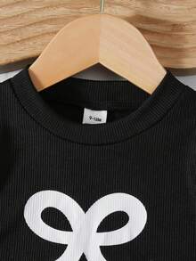 SHEIN Playful Pals 2件/套 嬰兒女童春夏季新款背心上衣與短褲套裝，黑色蝴蝶結印花無袖上衣 + 米色波點蝴蝶結裝飾短褲，柔軟可愛親膚休閒百搭時尚套裝 - 黑與白 - 查看 5