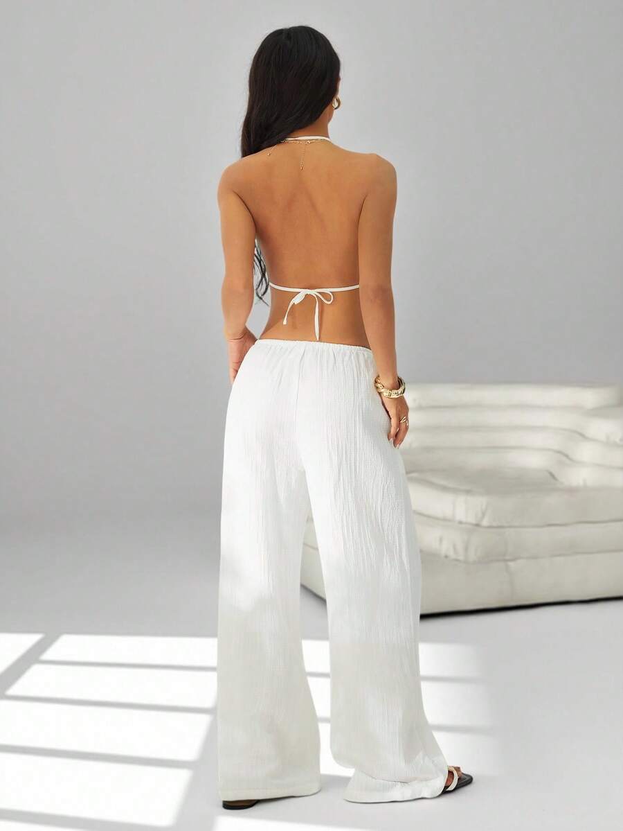 SHEIN PETITE 两件套服装，包括系带露背吊带背心和阔腿抽绳裤，适合夜店、度假、海滩、锐舞派对、夏威夷海岛度假等场合。