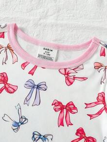 [Enviado al azar 1 set]Pijama de 2 piezas para bebé niña con top de cuello redondo y manga corta y pantalones largos. Este conjunto rosa claro y blanco presenta un estampado caprichoso de elefante de dibujos animados y estrellas de buenas noches con nubes y lazos. Confeccionado en tela de punto suave para una sensación agradable al tacto durante el descanso casual y el sueño en todas las estaciones. - Multicolor - Ver 5