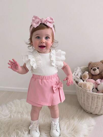 Souflis Souflis Bộ 2 món cho bé gái gồm áo không tay viền bèo nhún và chân váy ngắn thắt nơ, trang phục mùa hè dễ thương thường ngày.