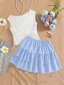 SHEIN 這款全新 2 件式青少年女孩套裝採用時尚休閒度假風，舒適彈性針織提花藍色圓領套頭背心搭配同色系雙層蛋糕裙。背心的收腰與下擺設計營造出優雅整體造型。高品質面料適合日常穿著，包括度假、旅行與派對，是春夏季的理想選擇。 - 藍色 - 查看 2