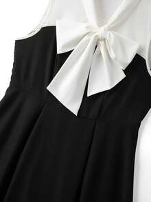 GlowEve CURVE Elegantes ärmelloses A-Linien-Midikleid in Große Größen mit Schleifenkragen und Farbblock, formelles Damenkleid für Party, Cocktailparty, Hochzeitsgast, schwarzes und weißes ärmelloses Schleifenkleid in Große Größen, elegantes A-Linien-Midikleid, geeignet für Party und Hochzeit - Schwarz und Weiss - Übersicht 5