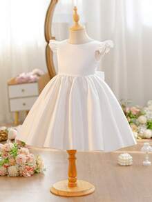 SHEIN Glamorique Kids 女童簡約白色正式禮服，柔軟緞面背部附可拆式大蝴蝶結，花童婚禮禮服，兒童生日公主長裙，晚宴派對服飾，夏季穿搭，迷人大裙擺，時尚正式穿著，派對禮服指南，度假風洋裝，畢業舞會禮服，四季皆宜 - 米色 - 查看 6
