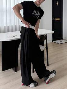 DAZY Pantalones holgados de cintura elástica negros largos con diseño de etiqueta para hombres - Negro - Ver 8