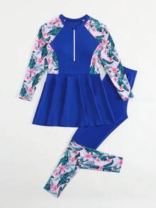 SHEIN 青少年女孩坦基尼比基尼套裝，保守度假風，深藍色身軀搭配粉色與白色熱帶花卉印花（棕櫚葉+粉色花朵）袖口與側縫，半開前拉鍊設計，裙襬，深藍色泳褲搭配相同熱帶花卉印花袖口，2件組，時尚休閒優雅成熟女士風，適合游泳、夏季度假、海灘、海邊、泳池、夏季假期派對、休閒度假 - 寶藍色 - 查看 6