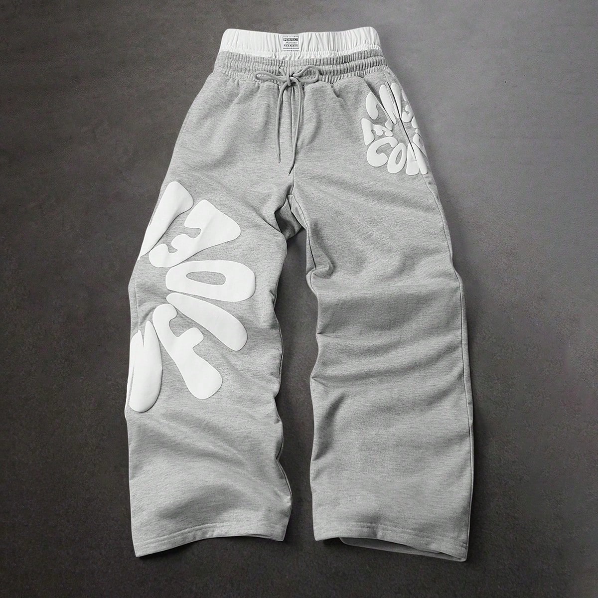 Pantalones de chándal casuales con cordón en la cintura y ajuste holgado con estampado de letras para hombre