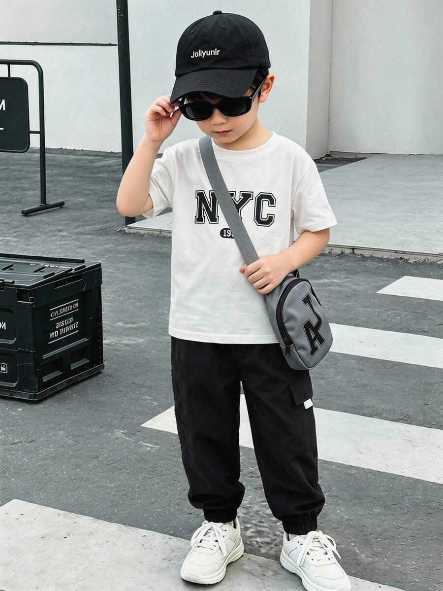 两件套男童时尚黑色T恤和卡其色长裤套装,面料柔软舒适,适合外出、拍照、运动、夏季及各种场合,款式时尚帅气。 - 黑與白 - 查看 1