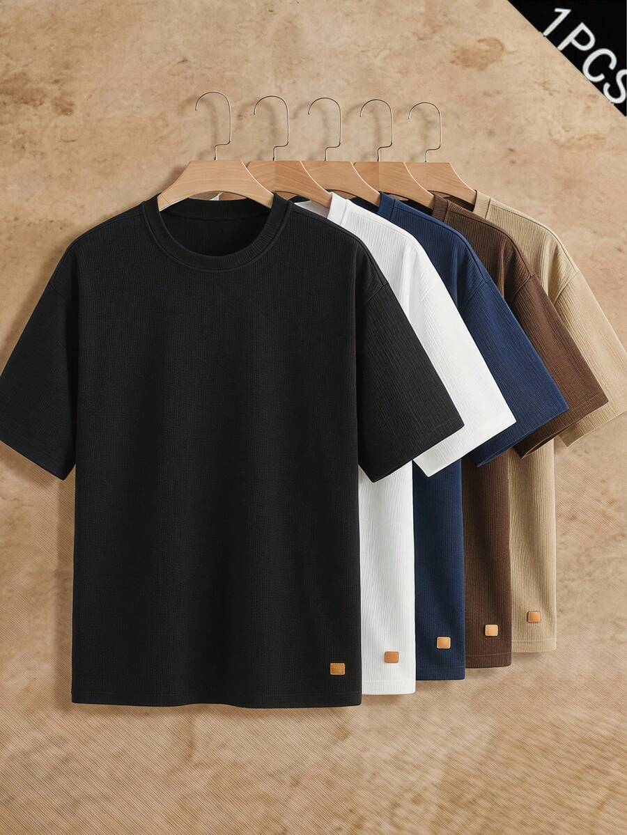 HIMLAND Men's Solid Color Round Neck Short Sleeve Casual Versatile T-Shirt - Black - View 1