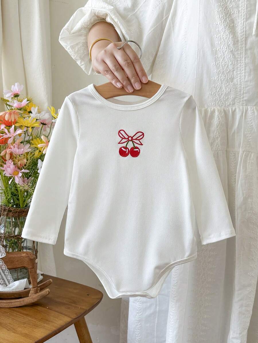 SHEIN Baby Girls Spring/Autumn White Ribbed Long Sleeve Bodysuit, Cute Cherry Bow Embroidery Design, Soft Skin-Friendly Elastic Fabric, Comfortable, Suitable For Newborn Daily Wear, Layering, Photo Outfits, Versatile Wardrobe Essential, Thoughtful Baby Gift Choice - White - View 1