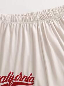 SHEIN American Retro Colorblock Polo Collar Design, Cream & Red Trim Eye-Catching! English Print + Number Elements, Effortlessly Wear Street Style Girl Vibe. Knitted Fabric Refreshing, Top + Shorts Set, Suitable For Sports And Street, Essential For Energetic Girls In Summer! - Beige - View 5