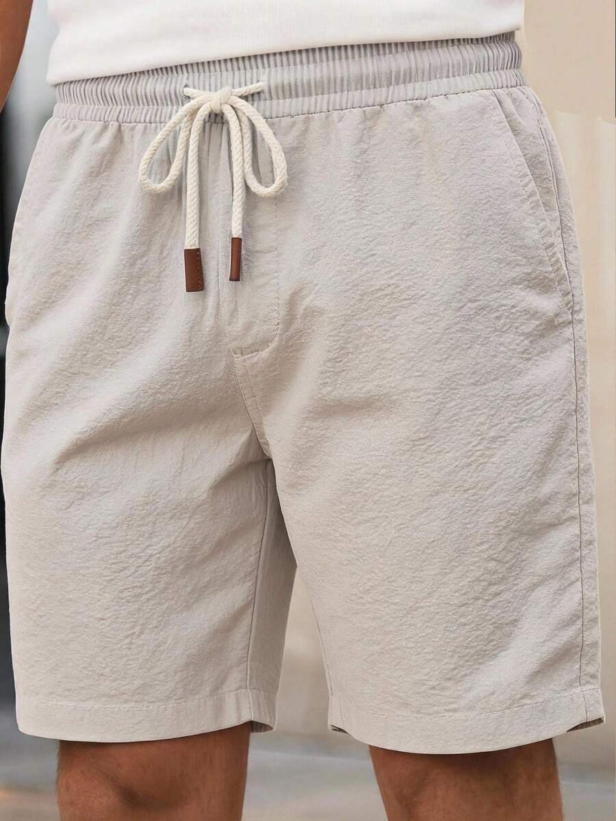 HIMLAND Pantalones cortos casuales de unicolor con cordón en la cintura y bolsillos para hombres de talla grande - Beis - Ver 1