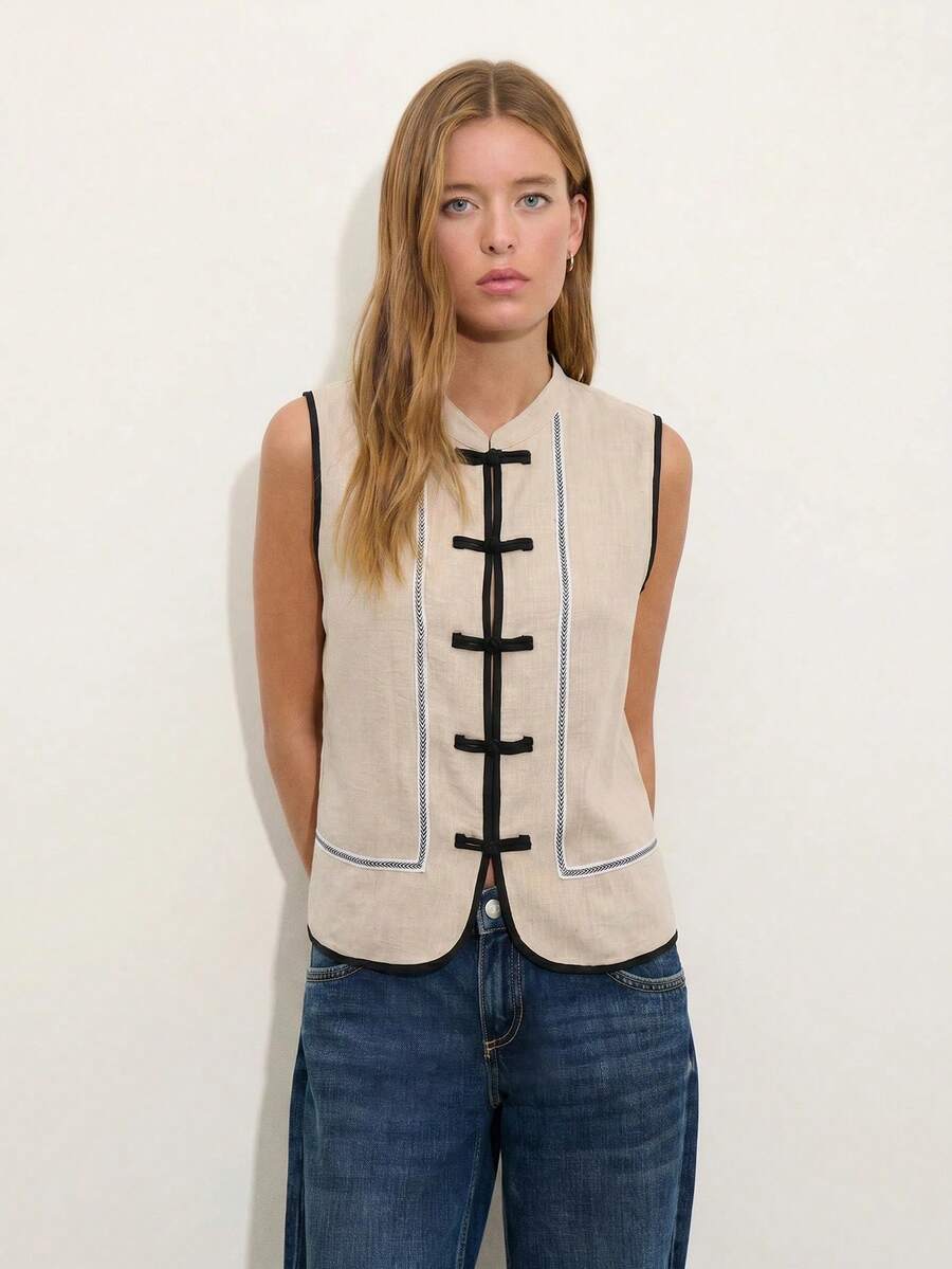 Nöista Sleeveless Top In A Soft Chambray-Blue Tone With A Mandarin Collar And Chinese Button Front. Contrast Purple Trim And Decorative Piping, Everyday Styling, Summer, Easter, Formal Event, Everyday. Spring. - Apricot - View 1