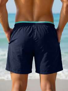 ZELFYO Pantalones cortos de playa para hombre con cordón en la cintura, patrón de letras y bloques de color para vacaciones de verano - Azul Marino - Ver 2