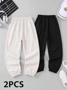 SHEIN Explorewe 2-Pack Tween Boys All-Match Versatile Side Asymmetrical Stripe Solid Color Pants Elastic Cuff Loose Fit Casual Trousers - Black and White - View 2