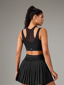 OutZeal Top deportivo para mujer color negro con sujetador integrado, panel de malla, protección UV, para gimnasio y entrenamiento - Negro - Ver 7