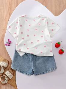 SHEIN Playful Pals 返校季女童休閒可愛圓領標準肩蝴蝶結印花T恤與素色牛仔裙褲套裝，適合夏季、日常外出、居家及聚會 - 白色 - 查看 3