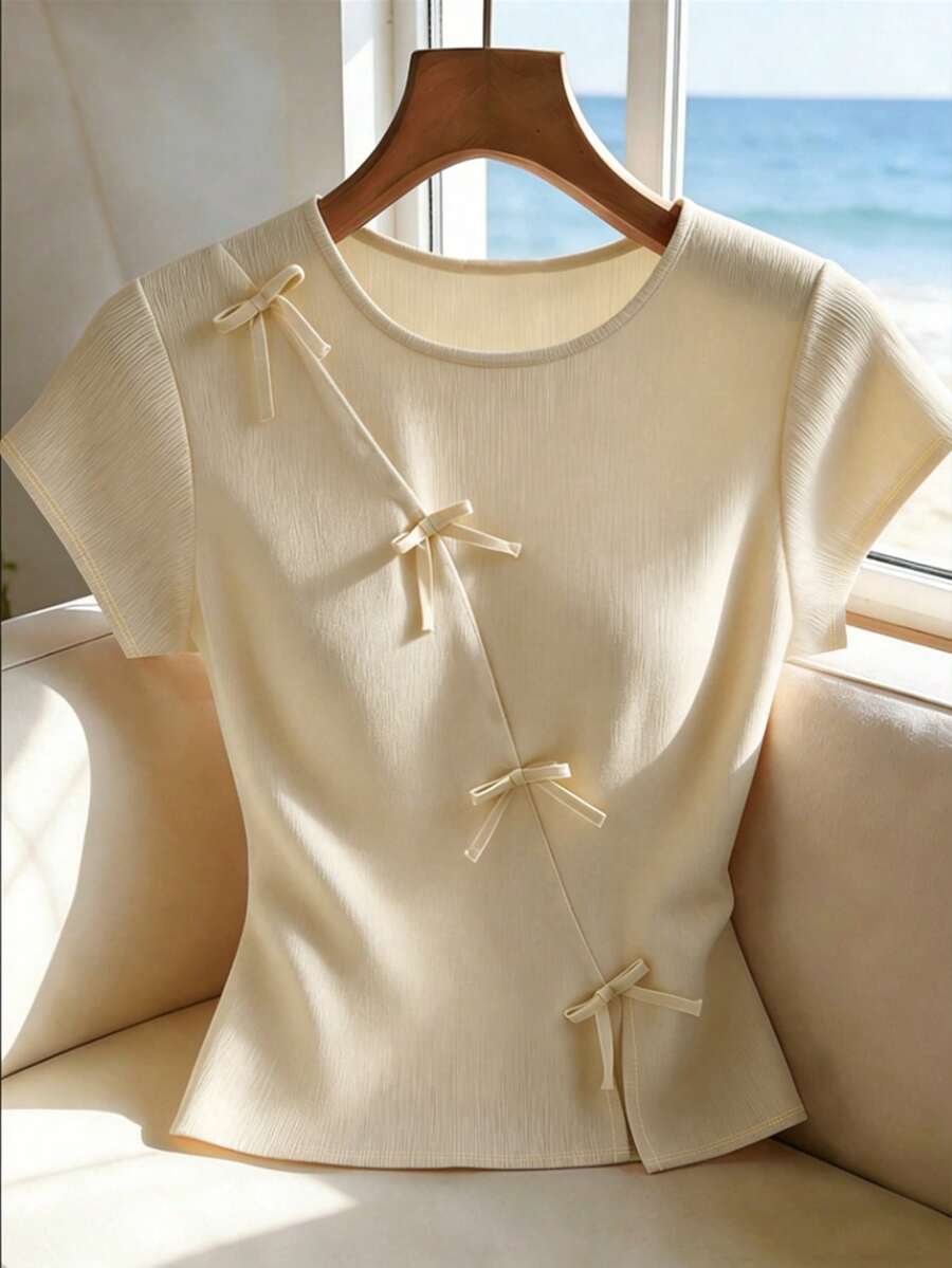 SHEIN Franclia 女款圓領蝴蝶結裝飾短袖T恤,復活節,夏季,黃色,休閒,度假,通勤上衣,日常穿搭 - 杏色 - 查看 1