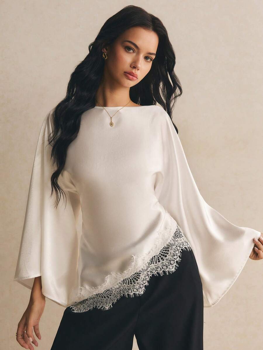 Poéselle Áo blouse nữ thanh lịch đi làm màu trơn tay chuông phối ren vạt bất đối xứng