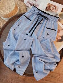 GlowEve Pantalones rectos de mujer de cintura alta con bolsillos, detalles a rayas y lazo, estilo casual y holgado, para verano - Azul - Ver 1