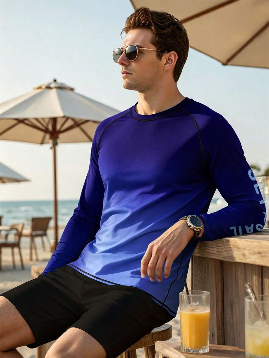 Naviga Onda Camiseta de surf de manga larga con cuello redondo, manga raglán, estampado de letras y color degradado para hombre - Azul Marino - Ver 1