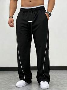 Manfinity CasualCool 男士成熟休閒彈性腰帶條紋設計寬鬆直筒運動長褲，適合日常休閒、週末出遊、旅行、朋友聚會等。這款長褲是男士衣櫥中必備的多功能單品，是送給男朋友或丈夫的完美禮物 - 黑色 - 查看 3