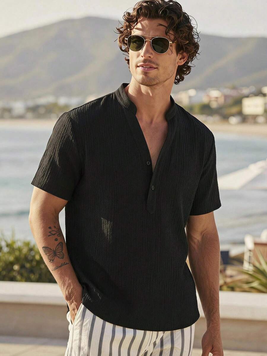 HIMLAND Loose Men Solid Half Button Shirt, Textured Short Sleeve Henley Half Placket Mandarin Collar Casual Pullover Summer Beach Vacation Resort Top Black - Black - View 1