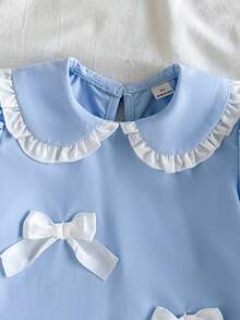 Vintaside Kids Younggirl 春夏淺藍色清新甜美娃娃領泡泡短袖洋裝，風格甜美可愛且具學院風，梭織面料，寬鬆版型，適中厚度，裙身飾有立體白色蝴蝶結，裙襬採荷葉邊設計，增添靈動感與層次感，適合休閒穿著、生日派對、上學等場合 - 藍色 - 查看 8