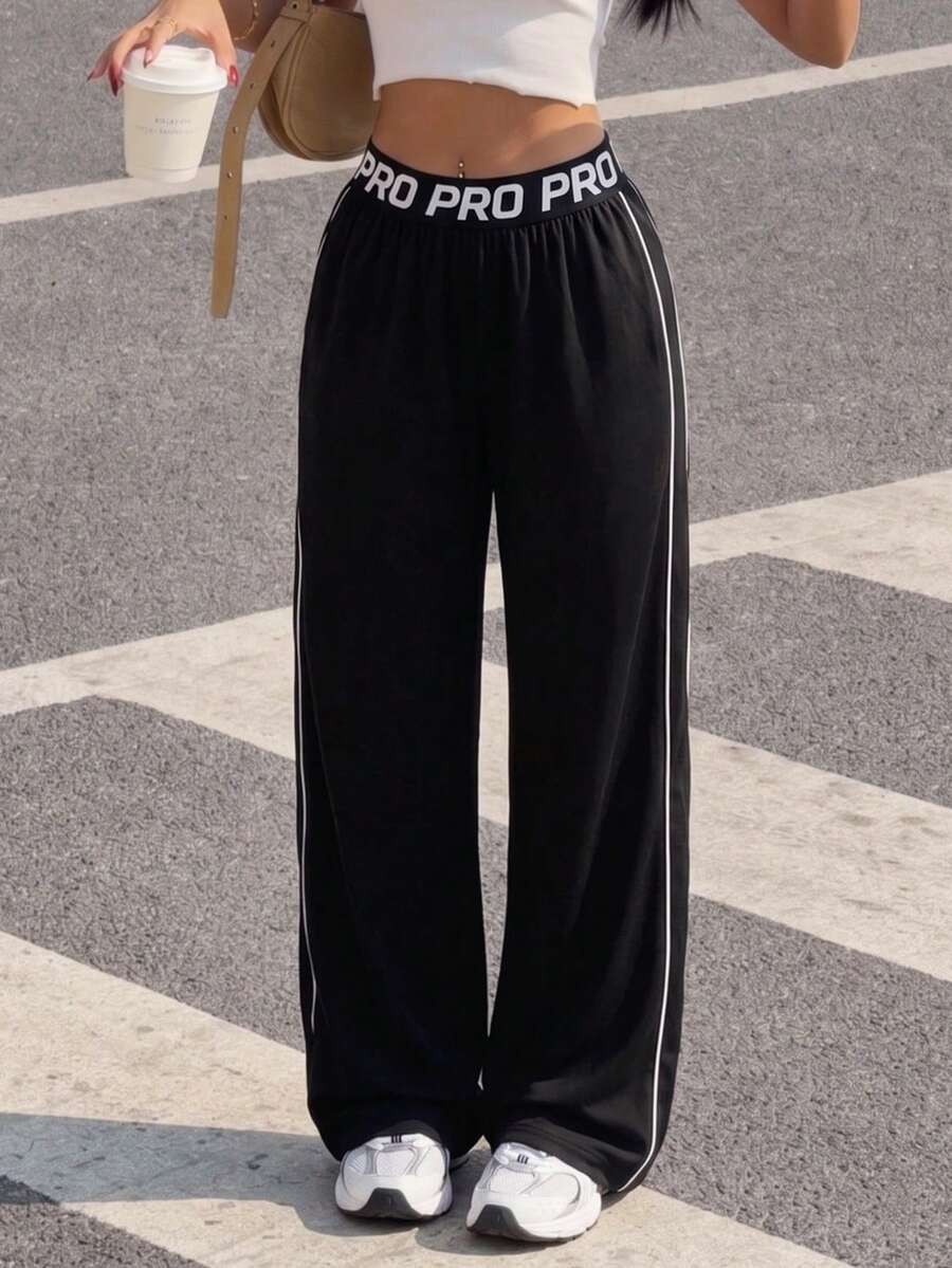 Dewbera Dewbera 春夏秋女款寬鬆顯瘦拉長腿長運動長褲，附口袋、腰帶拼接、運動標語、高彈力橡皮筋、直筒寬腿褲、撞色條紋拼接、開衩褲腳，適合日常休閒、跑步、瑜珈、健身房、網球、高爾夫等 - 黑色 - 查看 1