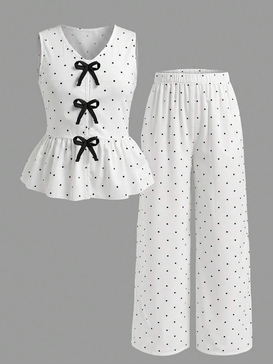 Elladie kids 青少年女孩無袖V領上衣，白色底色配黑色圓點與蝴蝶結元素，清新簡潔配色，統一且經典的風格。無袖上衣＋寬腿褲組合，保留少女魅力與優雅簡約，適合春夏穿著。