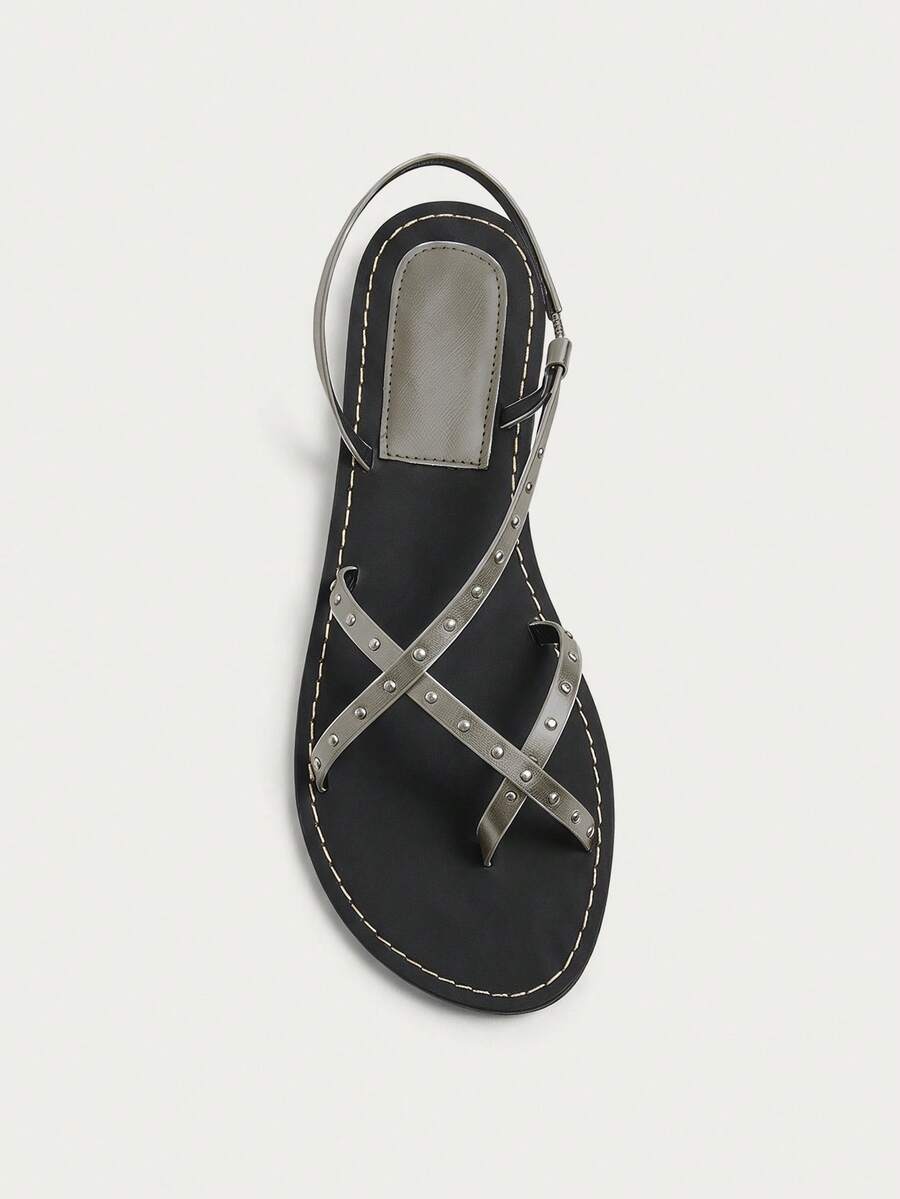 Nöista Flat Sandal With Crisscross Straps Adorned With Small Gold Studs. Summer Shoes - Grey - View 1