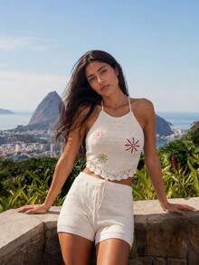Nöista Conjunto de dos piezas de ganchillo blanco con top corto de halter adornado con flores bordadas de colores y bordes festoneados. Emparejado con pantalones cortos de punto a juego con cordón en la cintura. Perfecto para el verano, festivales de música, estilo bohemio, fiestas en la piscina, ropa de playa, look de primavera. - Albaricoque - Ver 7