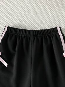 SHEIN Genkimix Kids 女童外套套裝，女孩春秋甜酷風蝴蝶結套裝，寬鬆連帽衛衣 + 運動長褲 2 件套，女童春季穿搭，休閒運動套裝，適合日常穿著、居家、學校、公園、週末出遊、運動、購物等多種場合 - 黑色 - 查看 6