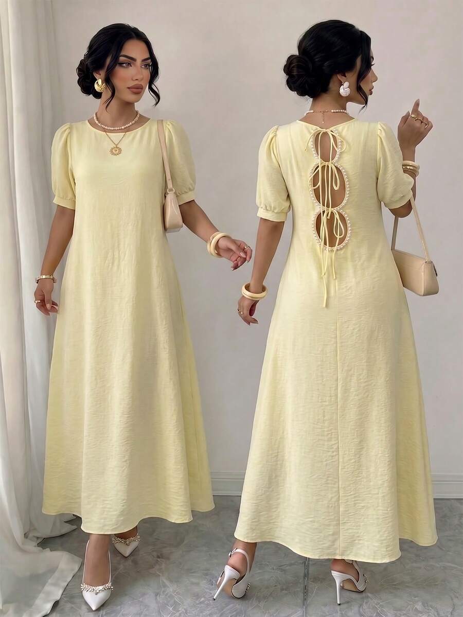 Elenzga Women's Spring/Summer Elegant Casual Commute Cream Yellow Textured Puff Sleeve Round Neck Loose Fit Flattering Back Pearl Ring Tie Hollow Design Long Dress - Yellow - View 1